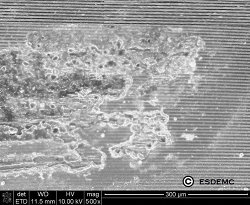 SEM image of die surface from ESD damaged PV bypass diode sample, melted metal and silicon observed